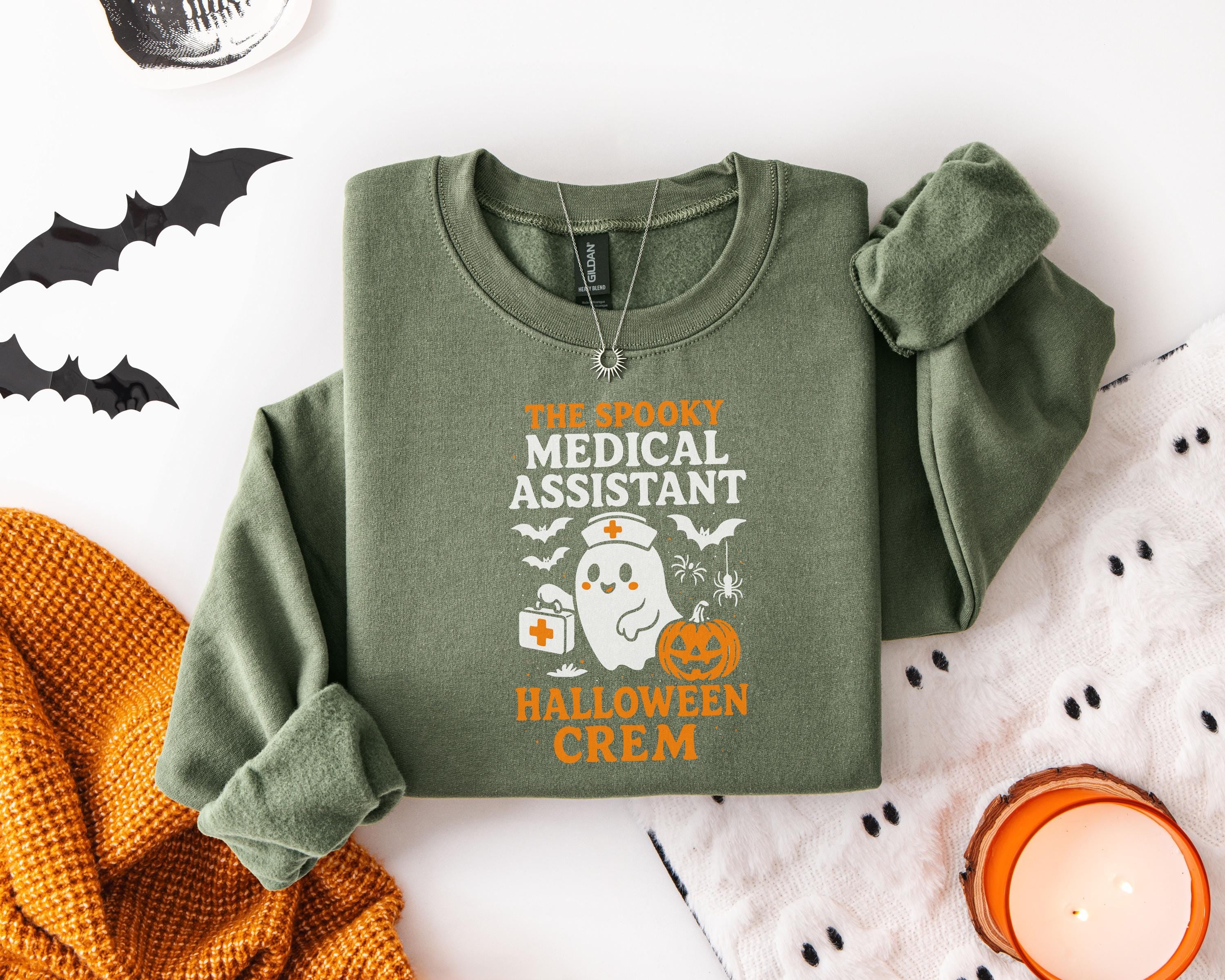 The Spooky Medical Assistant Halloween Crem shirt, Spooky Fall Pullover, Cozy Autumn Apparel, Gift for Nurse