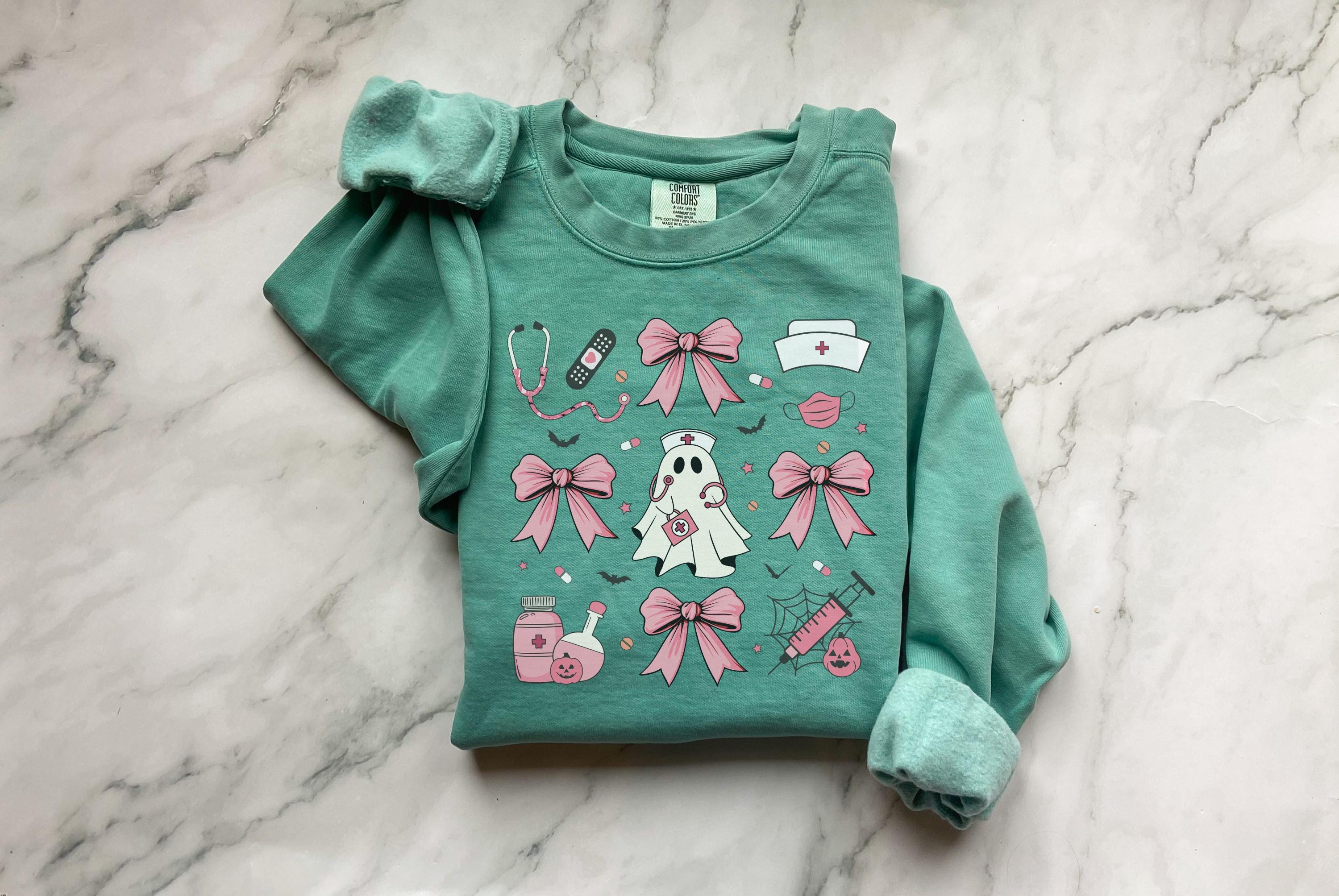 Cute nurse ghost Halloween Nurse Sweatshirt,  Pink Halloween Bow RN Fall Top Cozy Autumn Pullover, Cute Retro Gift for Nurse