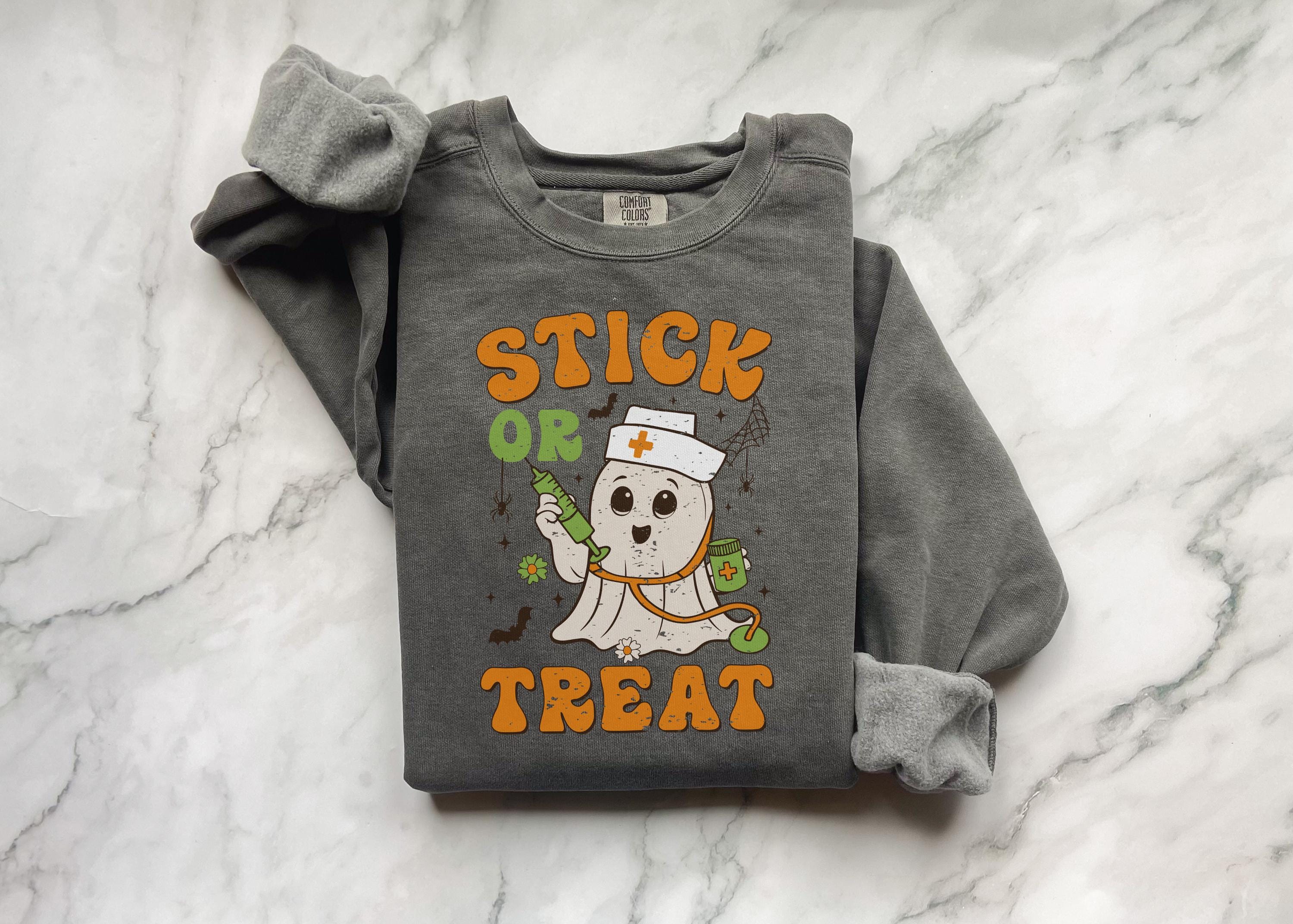 Stick or Treat Halloween Nurse Sweatshirt, Funny Ghost RN Top with Syringe, Spooky Medical Fall Apparel, Cozy Autumn Outfit, Gift for Nurse