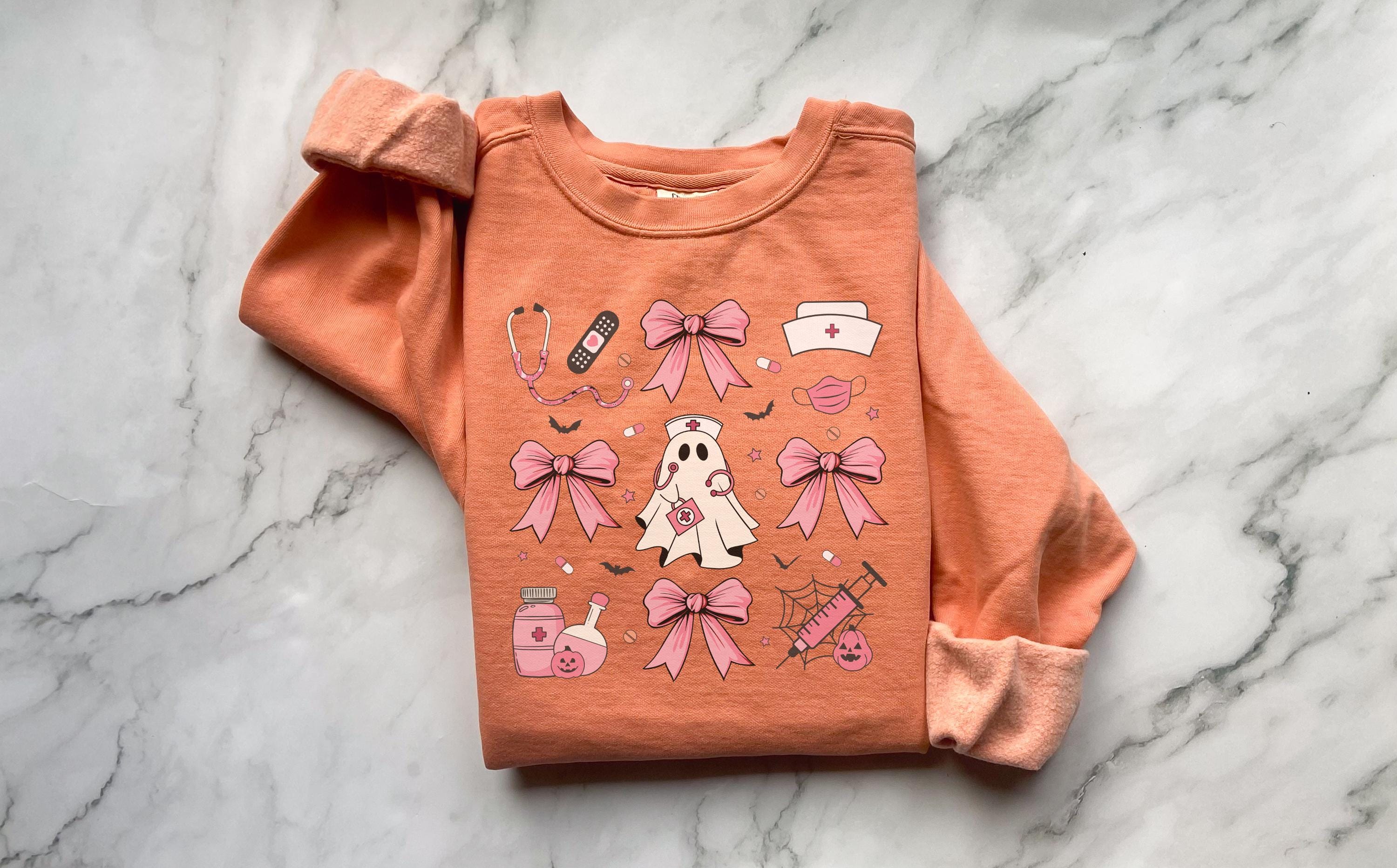 Cute nurse ghost Halloween Nurse Sweatshirt,  Pink Halloween Bow RN Fall Top Cozy Autumn Pullover, Cute Retro Gift for Nurse