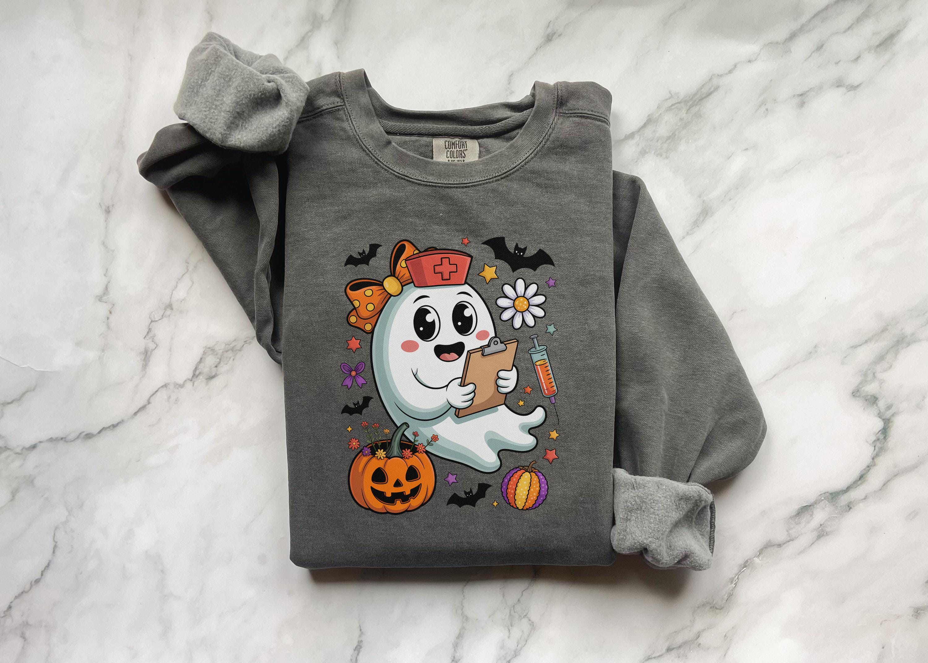Cute Ghost Nurse Halloween Sweatshirt, Spooky Medical Fall Shirt with Pumpkins and Bats, Funny Gift for Nurse or Healthcare Worker