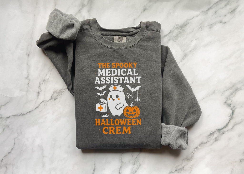 The Spooky Medical Assistant Halloween Crem shirt, Spooky Fall Pullover, Cozy Autumn Apparel, Gift for Nurse