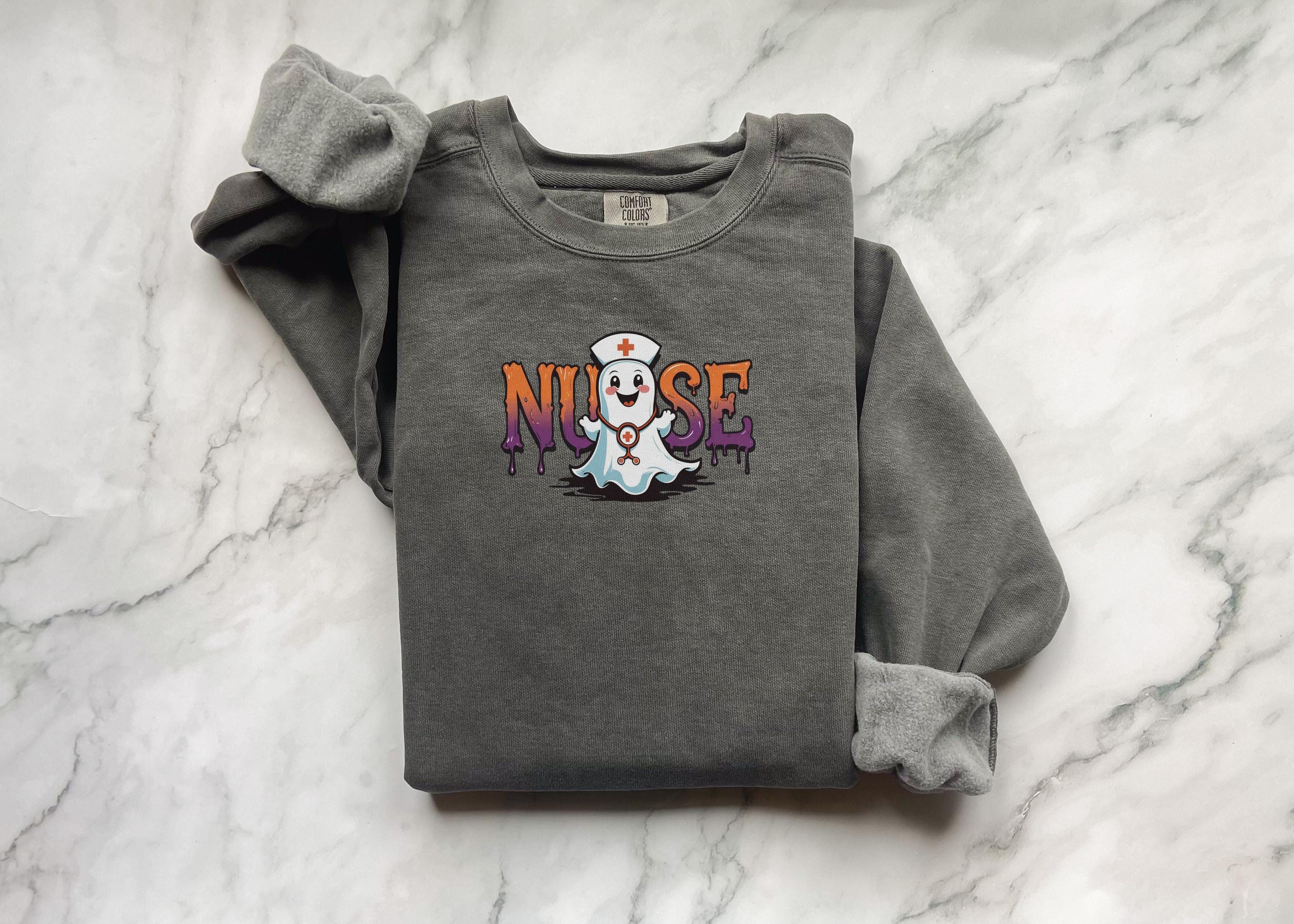 Halloween Nurse Sweatshirt, Cute Ghost RN Top with Syringe and Bats, Funny Spooky Medical Apparel, Cozy Fall Pullover, Unique Gift for Nurse