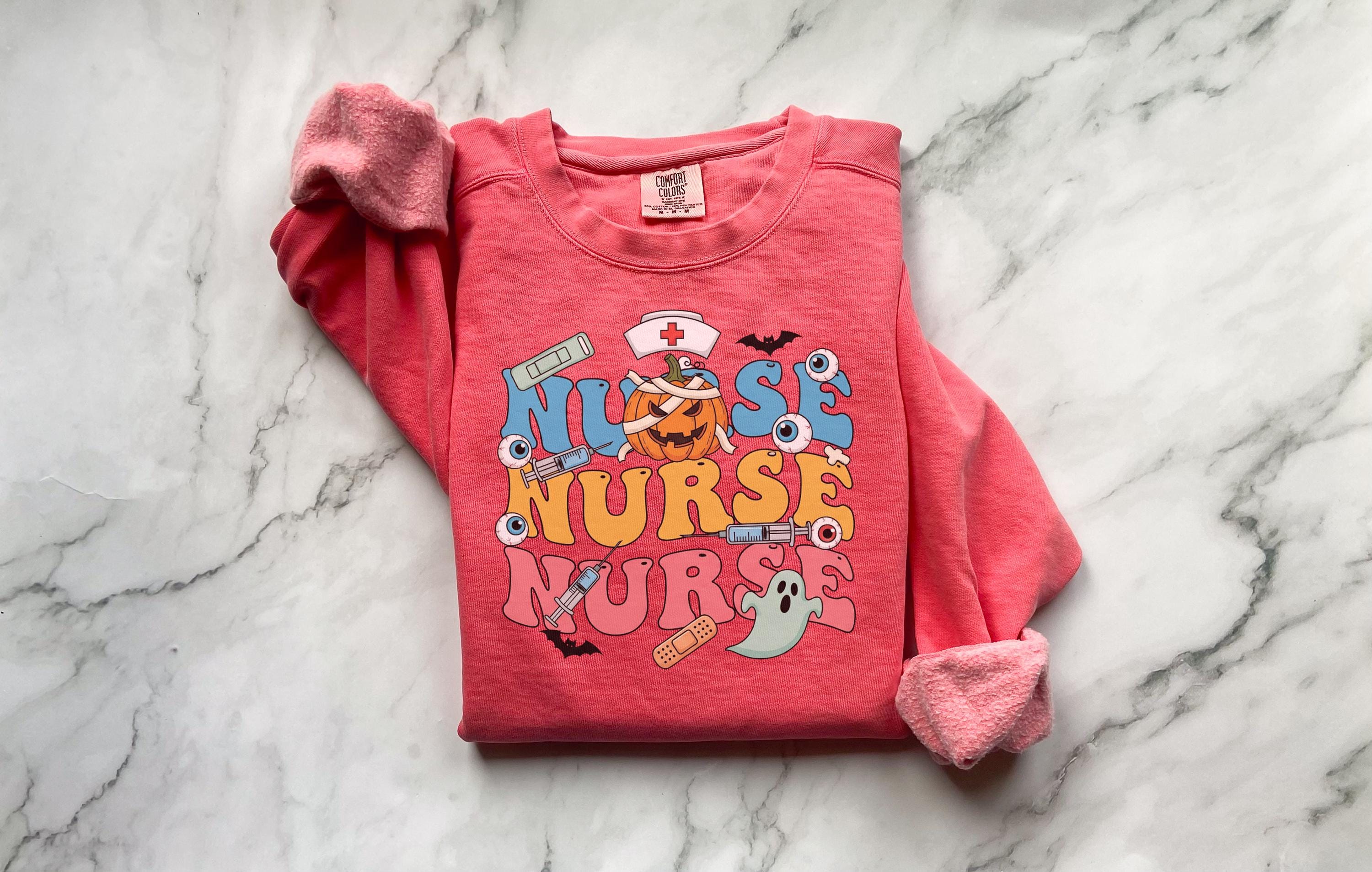 Vintage Nurse Halloween Colorful Sweatshirt, Cute Medical Fall Shirt with Ghosts, Pumpkin, and Eyeballs, Spooky Gift for Healthcare Nurse