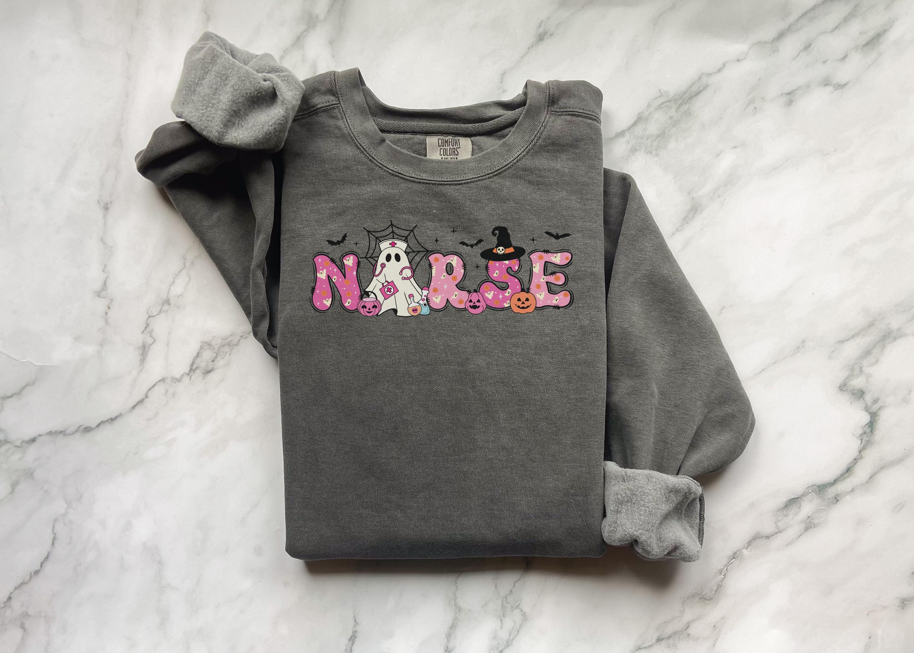 Pink Halloween Nurse Shirt: Spooky Ghost Outfit for Medical Staff