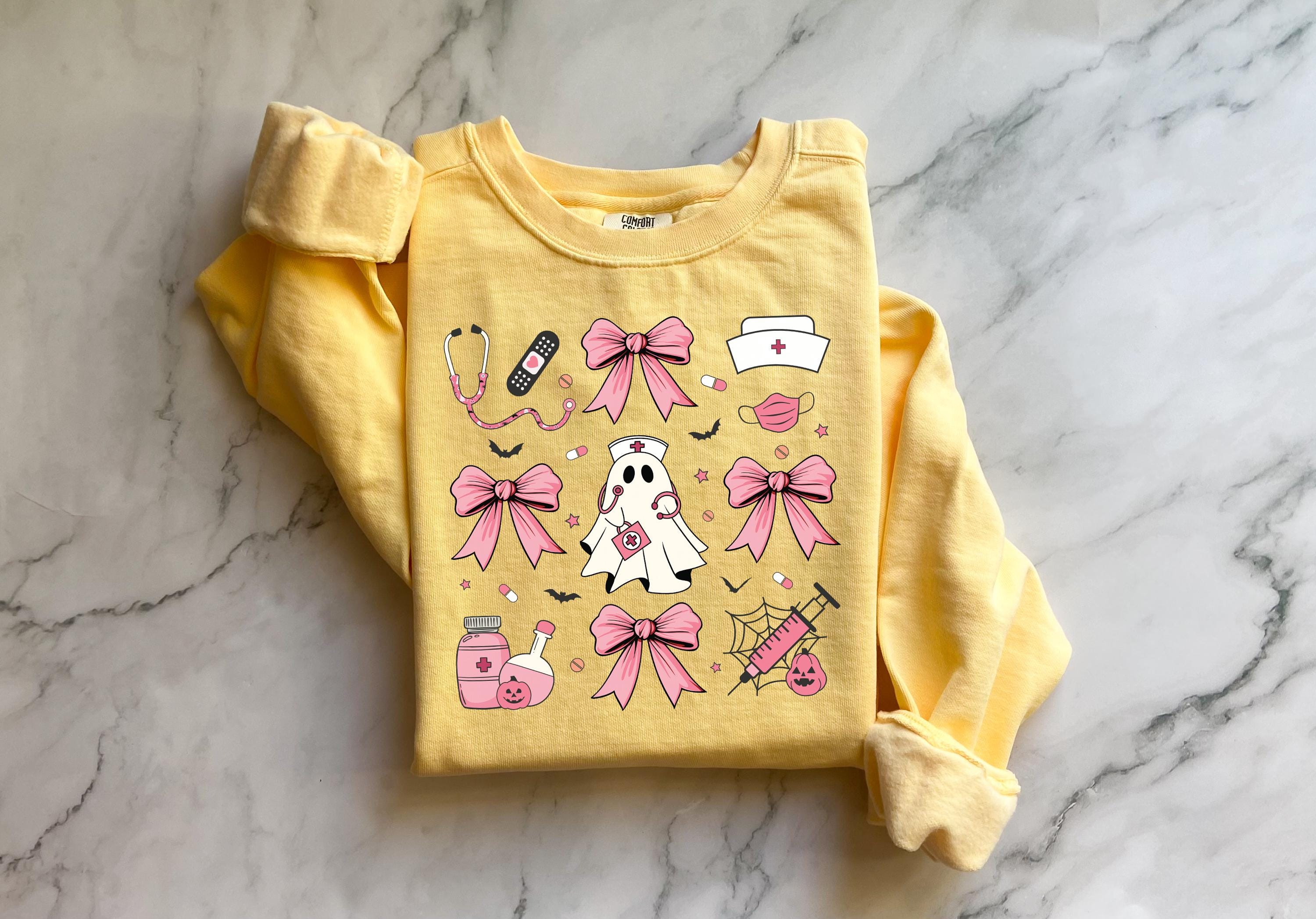 Cute nurse ghost Halloween Nurse Sweatshirt,  Pink Halloween Bow RN Fall Top Cozy Autumn Pullover, Cute Retro Gift for Nurse