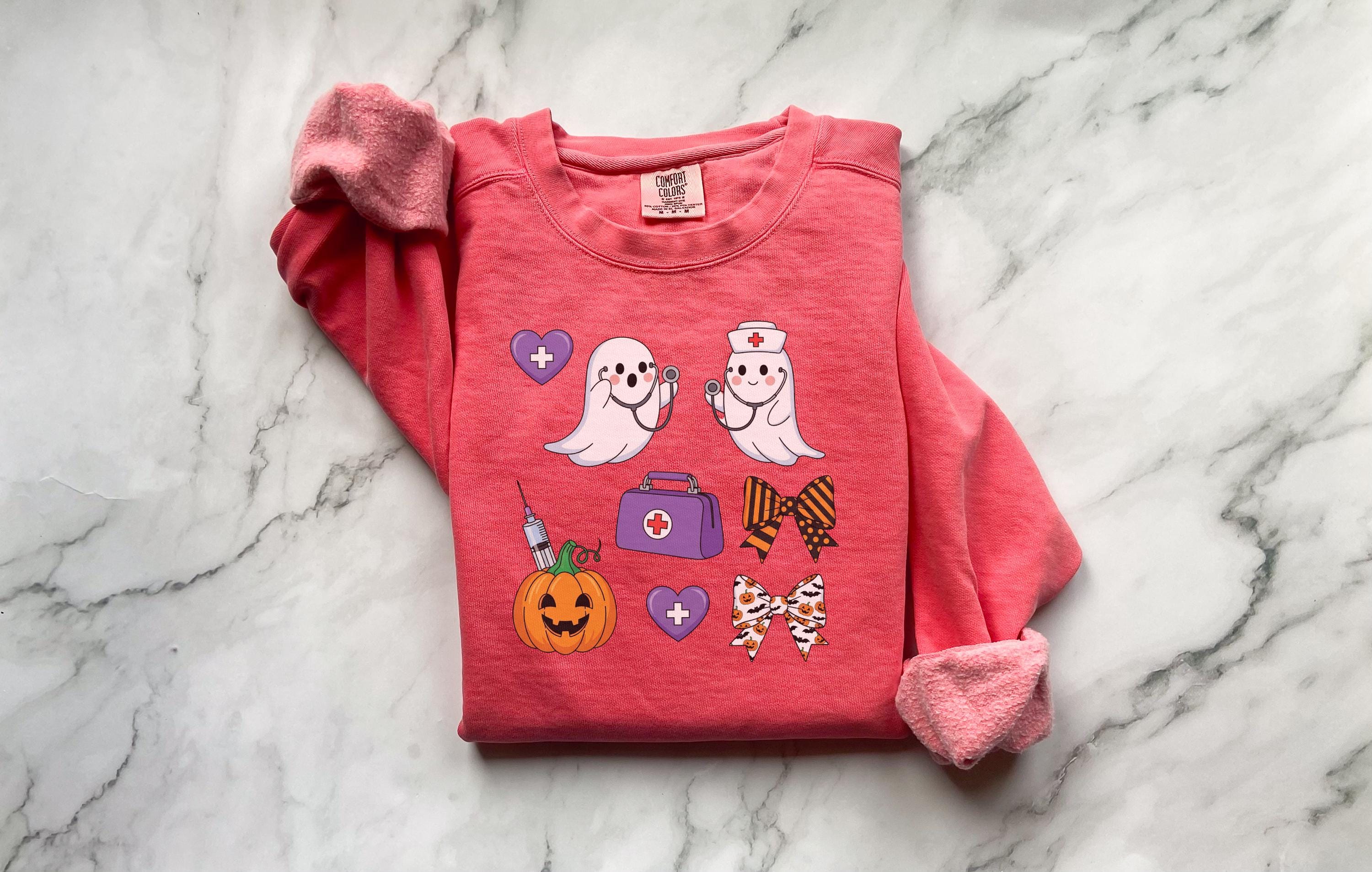 Halloween Nurse Shirt, Cute Ghost RN Tee with Pumpkin and Bows, Spooky Fall Medical Funny Trick or Treat Outfit, Gift for Nurse, ER Crew
